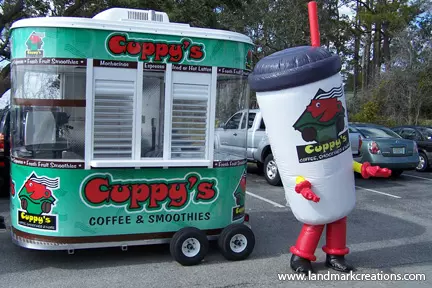 Inflatable drink cup costume in front of Cuppy's Coffee kiosk