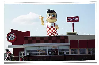 Frisch's Inflatable Big Boy Mascot Displayed on Restaurant Rooftop